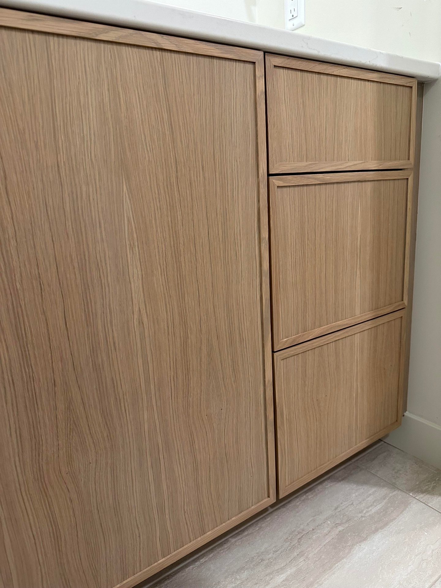Detail of rift-cut white oak inset cabinet doors and drawers